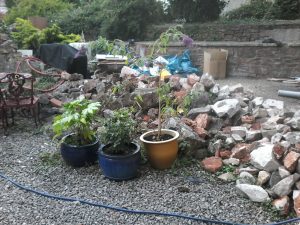 Collapsed party wall between gardens of 2 Georgian properties, Bristol.