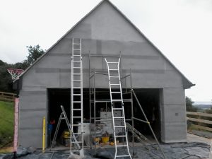 mesh being secured with concrete bolts