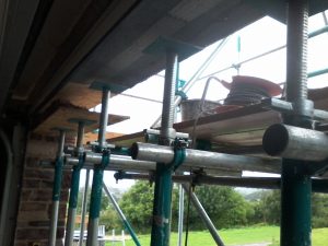 jacking system needed to secure stone to underside of steel beam