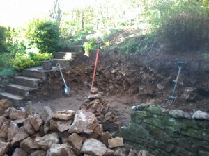 Former steps, brick facings, concrete slabs