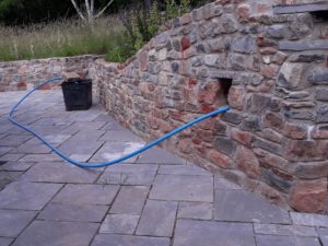 rebuilt wall with newly laid terrace (pre-grouting)