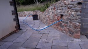 ...with newly built wall and paving..grouting awaited..