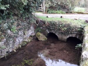 Collapsing C18th bridge facade