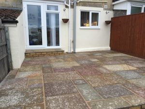 ..replaced by new sandstone paving...